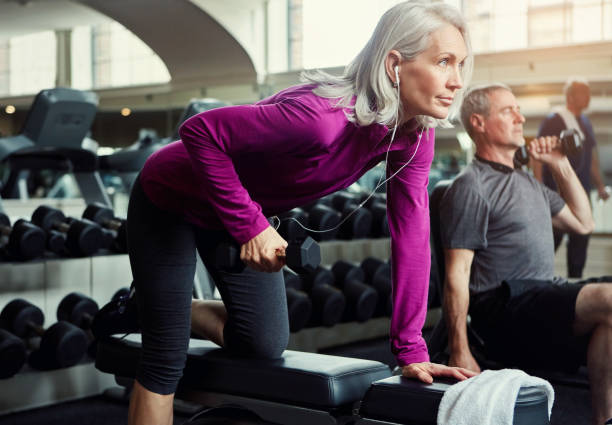 Woman lifting weights at gym